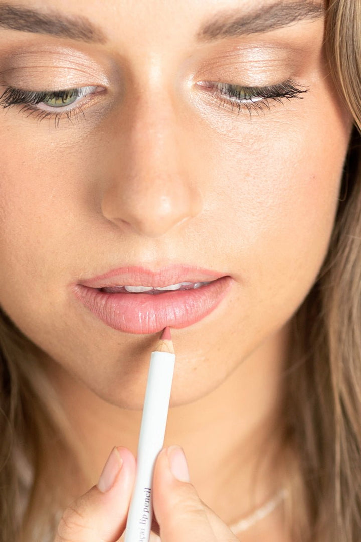 Acai Lip Pencil Kiss Model applying lip pencil