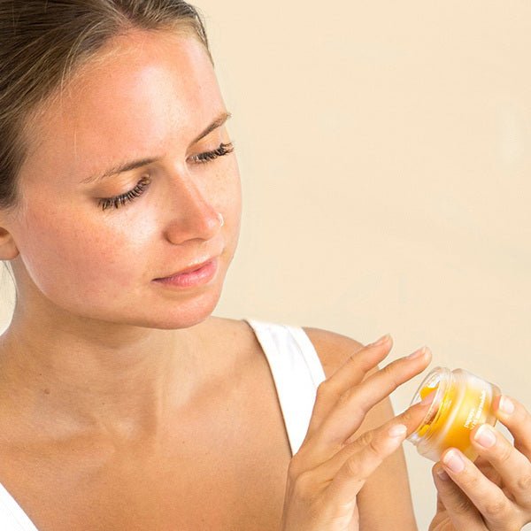 Ere Perez Papaya SOS Marmalade - open jar in front of female model