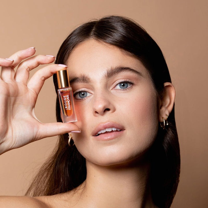 Lip Oil 613 Orange Persephone with model
