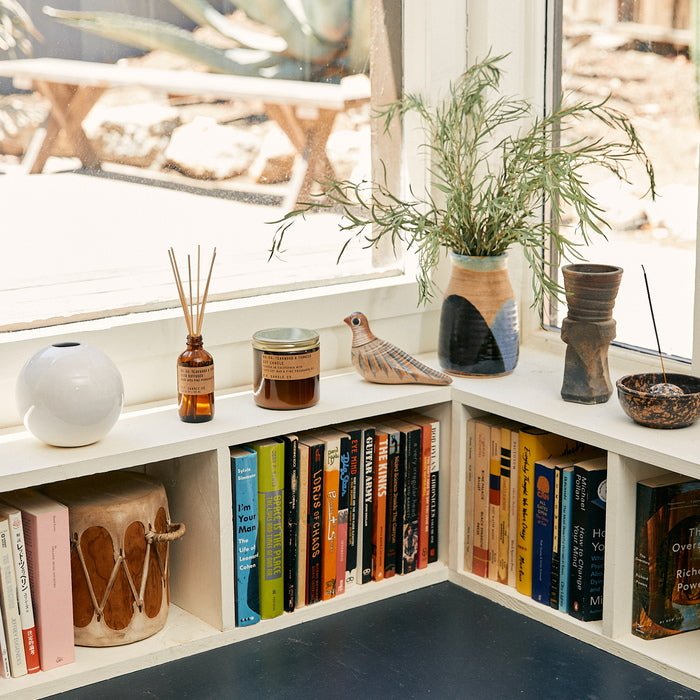 P.F. Candle Co. No. 04 Teakwood & Tobacco Reed Diffuser Mood in living room