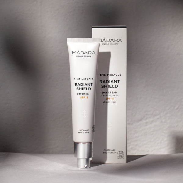 Mádara Time Miracle Radiant Shield Day Cream SPF 15 - mood in front of grey backdrop