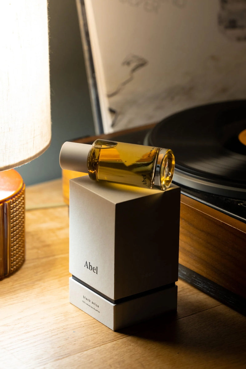 Black Anise Perfume Mood next to record player