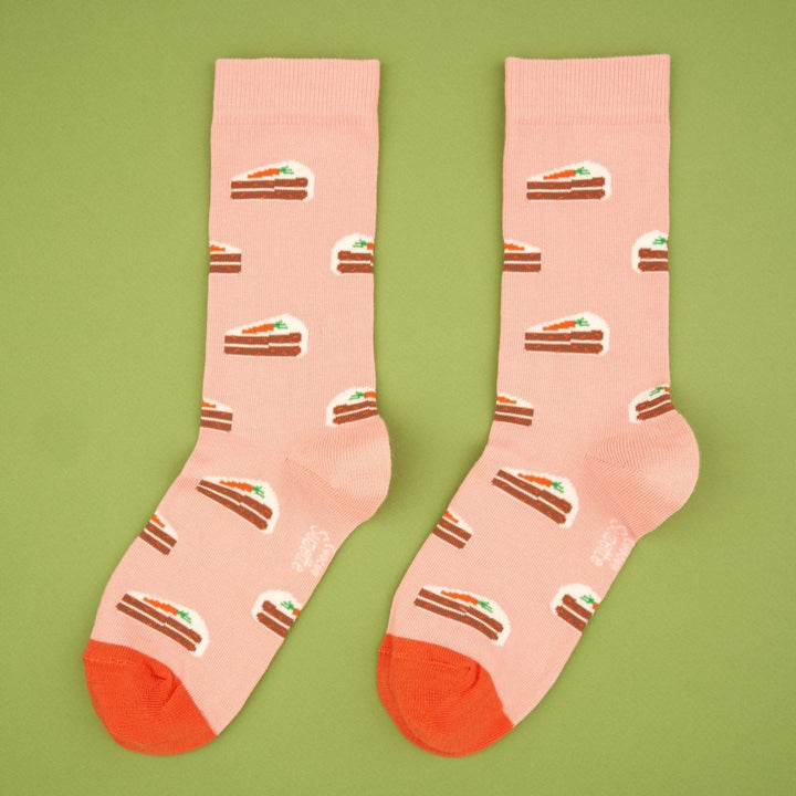 Coucou Suzette Carrot Cake Socks - product image with green background