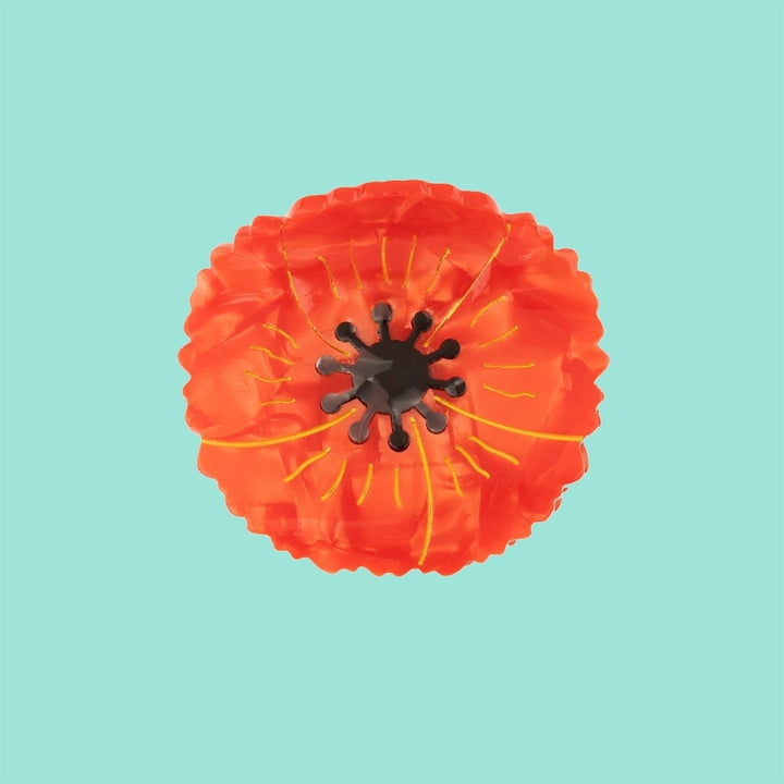 Coucou Suzette Poppy Hair Claw - product image with turquoise background
