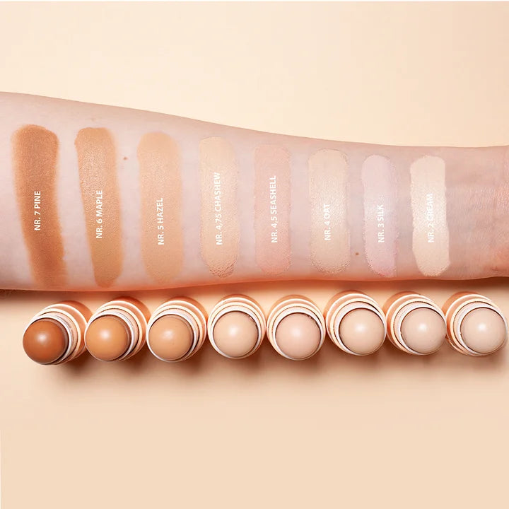 Concealer Balm Farbswatches auf Arm - alle 8 Nuancen von Nr. 2 Cream bis Nr. 7 Amber