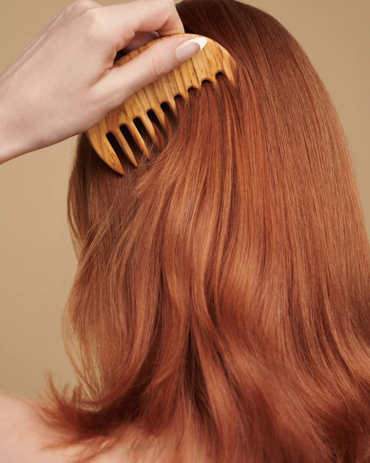Innersense Hair Renew Scalp Hairbath - Hair model combing her hair