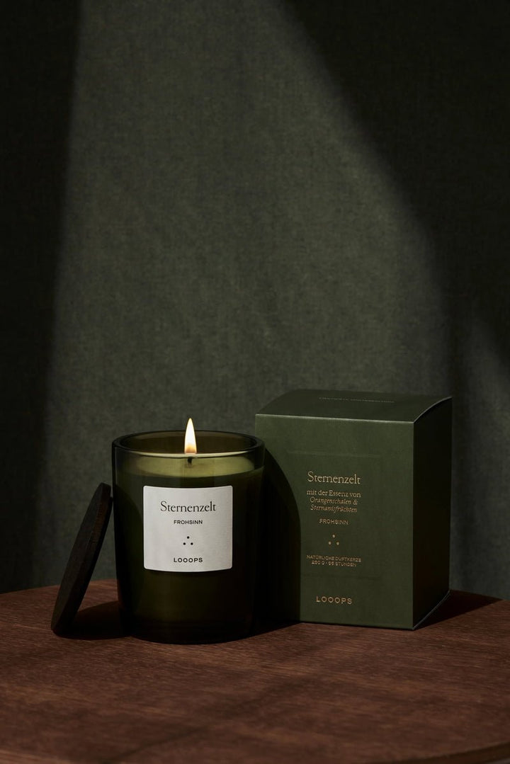 Burning candle starry sky