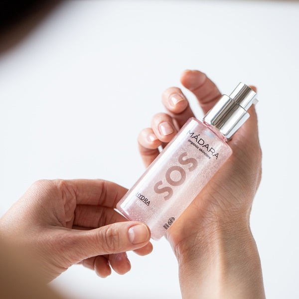 Mádara SOS Hydra Intense Rose Jelly | Rose water gel - bottle held in hand