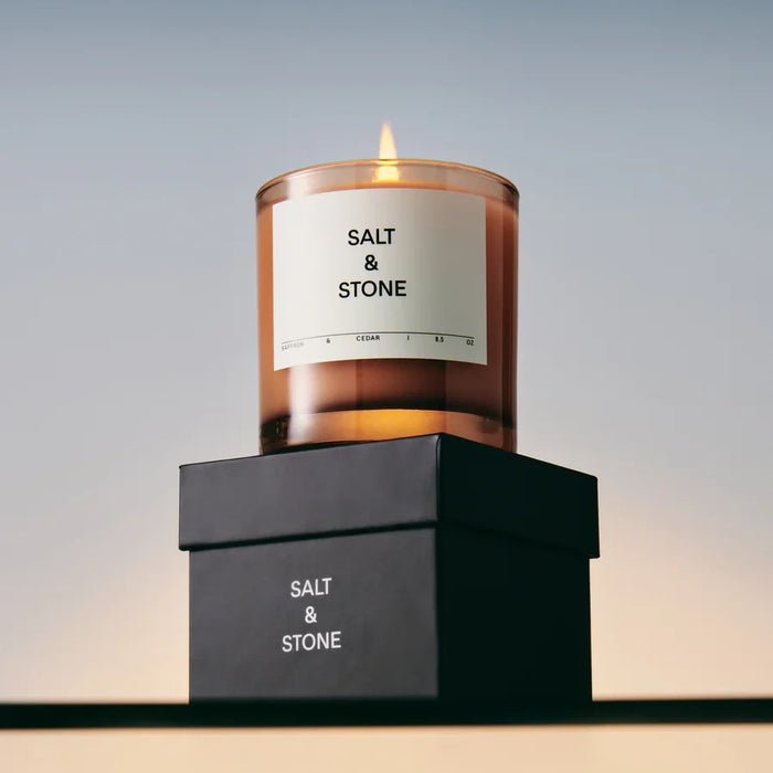 Salt & Stone Saffron & Cedar Candle - burning candle