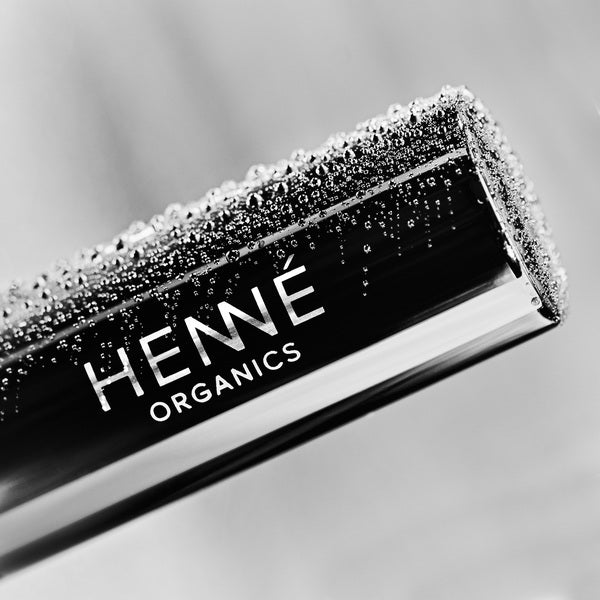 Henné Organics Luxury Lip Balm V2 close-up sleeve