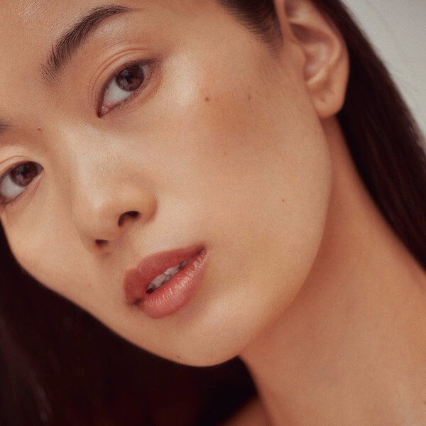 Henné Organics Luxury Lip Tint Intrigue on woman's lips