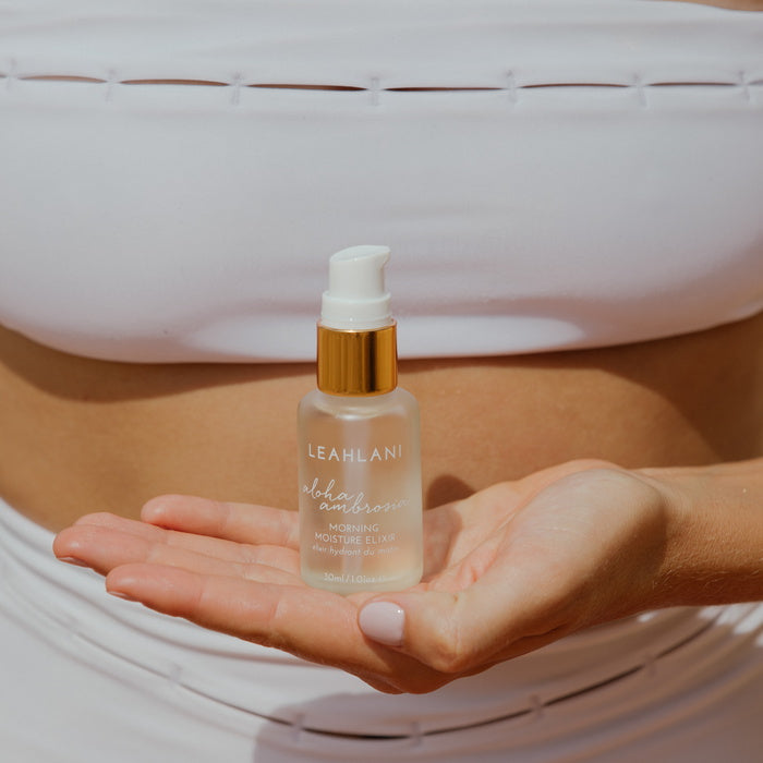 Leahlani Aloha Ambrosia Morning Moisture Elixir held in hand