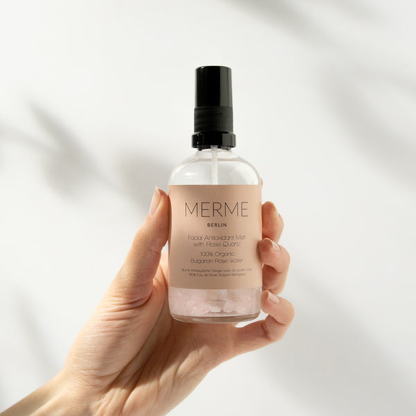 Merme Berlin Facial Antioxidant Mist With Rose Quartz 100% Organic Rosewater held in hand
