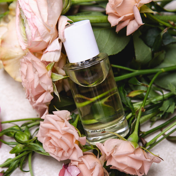 Abel Perfume Pink Iris lifestyle photo perfume lying on roses
