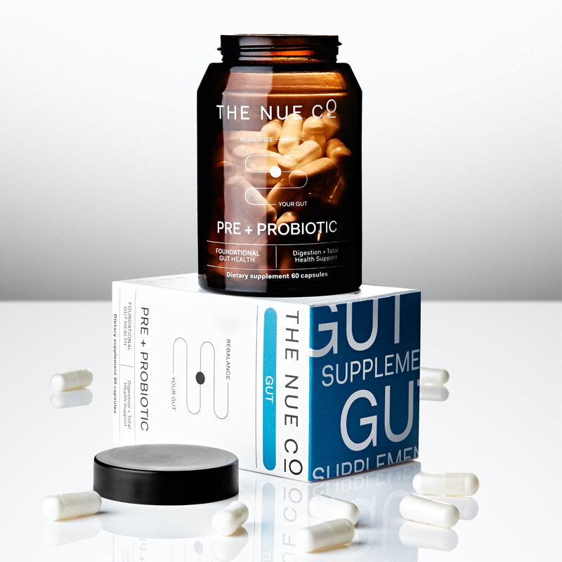 The Nue Co. Prebiotic + Probiotic with packaging and capsules