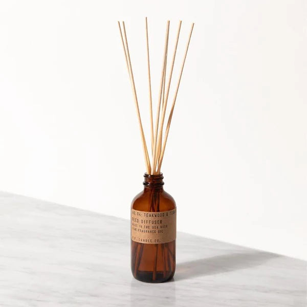 PF Candle Co. No. 04 Teakwood & Tobacco Reed Diffuser on marble plate
