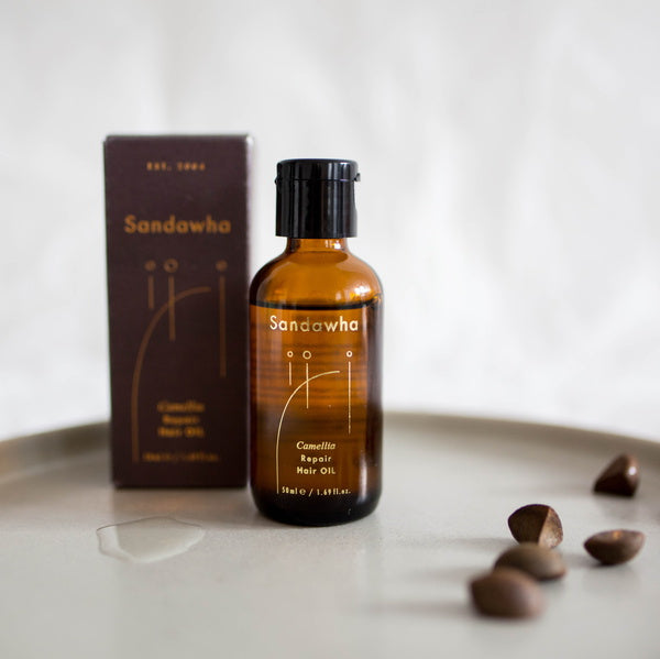 Sandawha Repair Hair Oil - with packaging and argan nuts