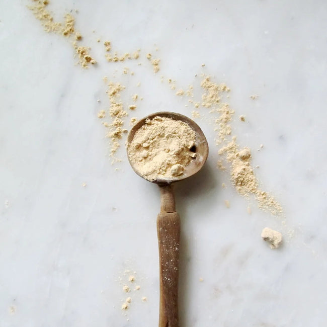 Qi Energy & Protein: Adaptogenic Superpowder - powder on spoon